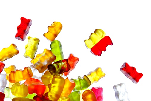 colorful, transparent, lighting gummi bears, isolated on white
