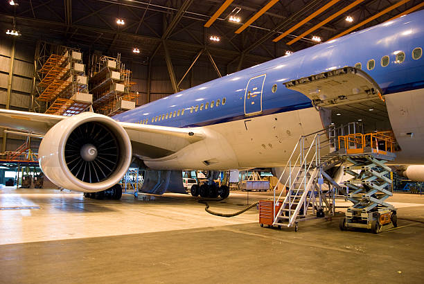 Man working on the jet engine, Commercia aircraft maintenance.