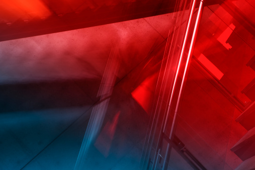 Interior stairwell; spotted/pitted texture of concrete walls evident. Entirely in-camera effect, single exposure, natural light.