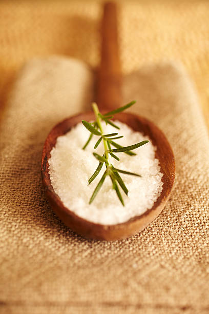 istock Rosemary on bath salt scrub in wooden spoon 157531044