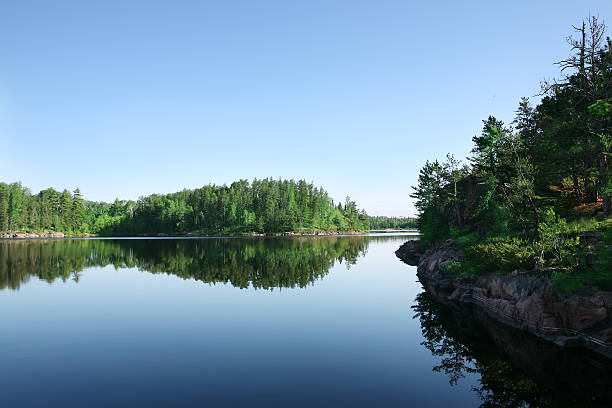 Serene Lake on Perfect Summer Morning Perfect summer morning on Crooked Lake in the Boundary Waters Canoe Area / Quetico Provincial Park.  boundary waters canoe area stock pictures, royalty-free photos & images