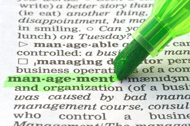 istock management definition highligted in dictionary 157531154
