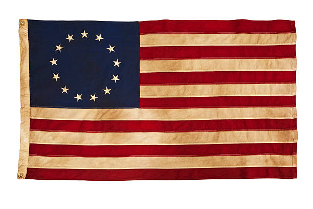Grungy Betsy Ross Flag With Thirteen Stars and Stripes This American Colonial Flag, popularly attributed to Betsy Ross, was designed during the American Revolutionary War features 13 stars to represent the original 13 colonies. According to the legend, the original Betsy Ross flag was made on July 4, 1776.  colonial style stock pictures, royalty-free photos & images