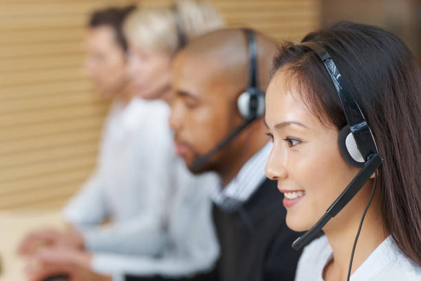 istock Female customer service representatives team working in a call centre 157531480