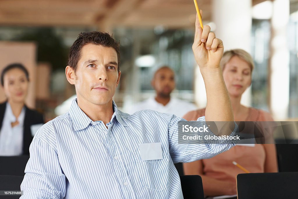 Businessman asking a question in meeting  Asking Stock Photo