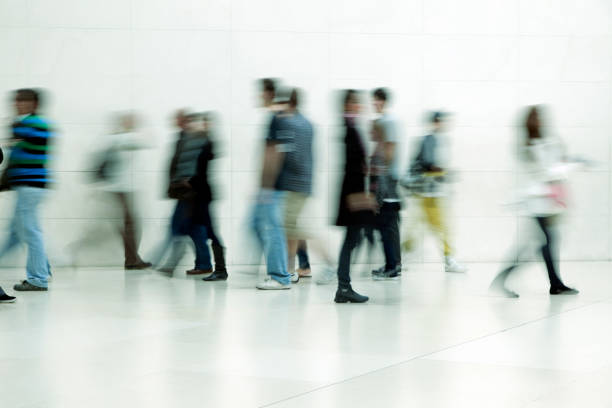 istock People walking in corridor, blurred motion 157531674