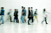 People walking in corridor, blurred motion