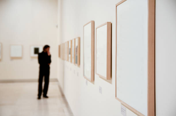 Art gallery Art gallery with insignificant man out of focus admiration photos stock pictures, royalty-free photos & images