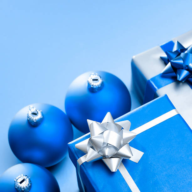 Blank Christmas card or invitation with blue envelope surrounded by decorations. Space for copy.Alternative image in this collection: