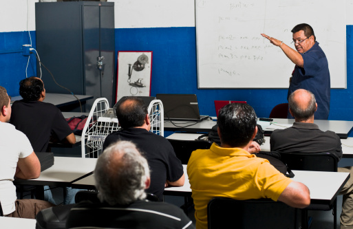 Hispanic Mechanics at a Training Class (this picture has been taken with a Hasselblad H3D II 31 megapixels camera)