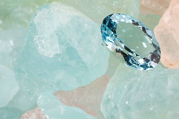 Aquamarine Gems(XXXL) Polished aquamarine is on rough aquamarine gems. aquamarine stock pictures, royalty-free photos & images