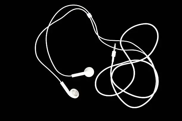 Photo of White Earbuds on Black