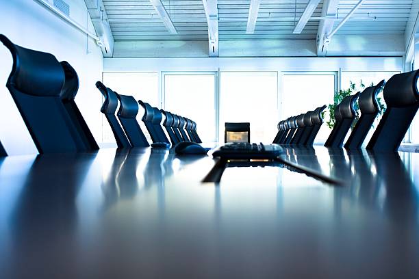 Conference room with large table and many chairs conference room mediation photos stock pictures, royalty-free photos & images