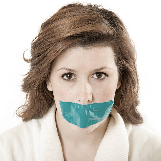 istock Young Woman Silenced With Tape Over Her Mouth 157533187