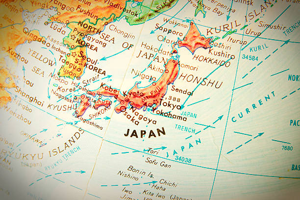 Travel the Globe Series - Japan Studying geography - Photo of Japan on retro globe. land feature stock pictures, royalty-free photos & images