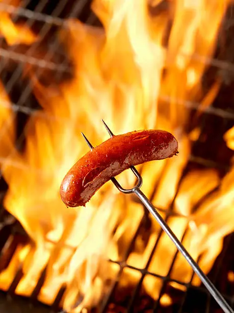 Photo of Hotdog (Smokie) Cooking on the Campfire