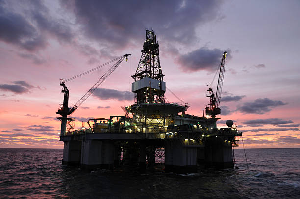 istock Oil rig at sunrise or sunset 157533676