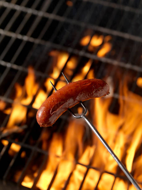 istock Hotdog (Smokie) Cooking on the Campfire 157533942