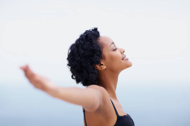 istock Smiling African American young lady with arms outstretched 157534224