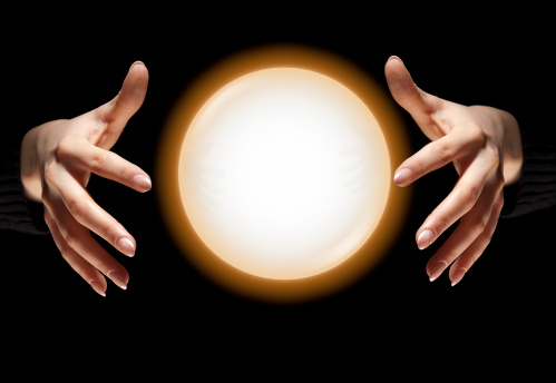 portrait of man holding a crystal ball with its reflection upside down