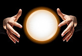 Fortune Teller's Hands With Glowing Crystal Ball, Dark Black Background