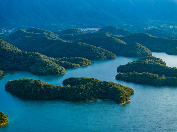 istock Blue lake and speedboat overlooking 1575397526