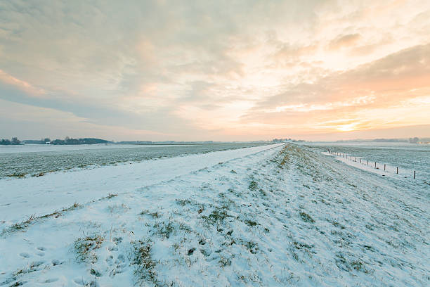 istock Dutch dike covered with snow in winter 157539772