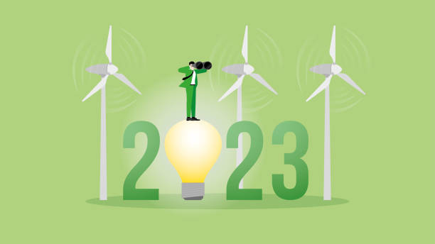 istock Green energy concept. Vision businessman uses binoculars on 2023 and wind turbine generator power. ESG, Renewable, Alternative, Sustainable Environmental policy, Carbon footprint, Net zero emission. 1575404139