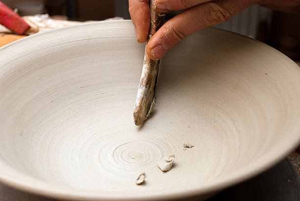 istock hands of a potter, creating an earthen jar 157541886