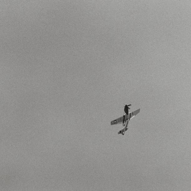 North American P-51 Mustang North American P-51 Mustang flying overhead at California Capital Airshow. p 51 mustang stock pictures, royalty-free photos & images