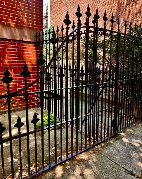 istock Ornate Black Wrought Iron Fencem 1575458469