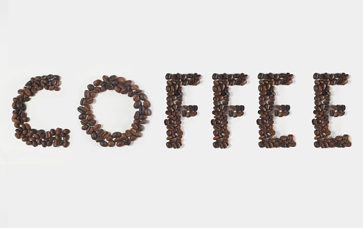 Roasted coffee beans forming the word “Coffee”