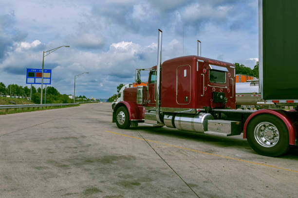 istock Cloudy Evening Halt: Semi Truck at Rest Area 1575511484
