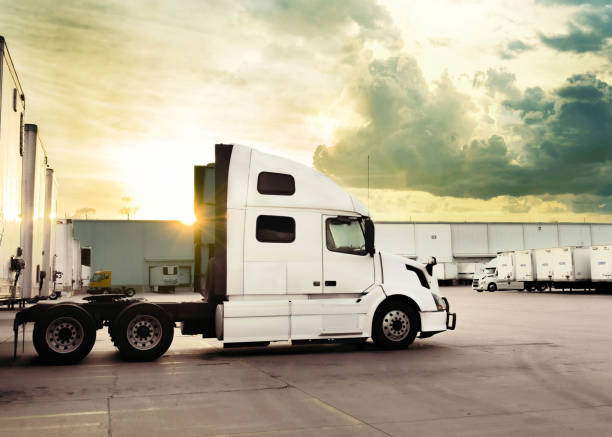 istock Pre-Rain Glow: Sunny Light at Trucking Delivery Yard 1575511811
