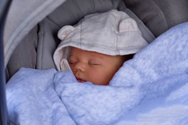 istock Newborn baby boy in baby stroller 1575560333