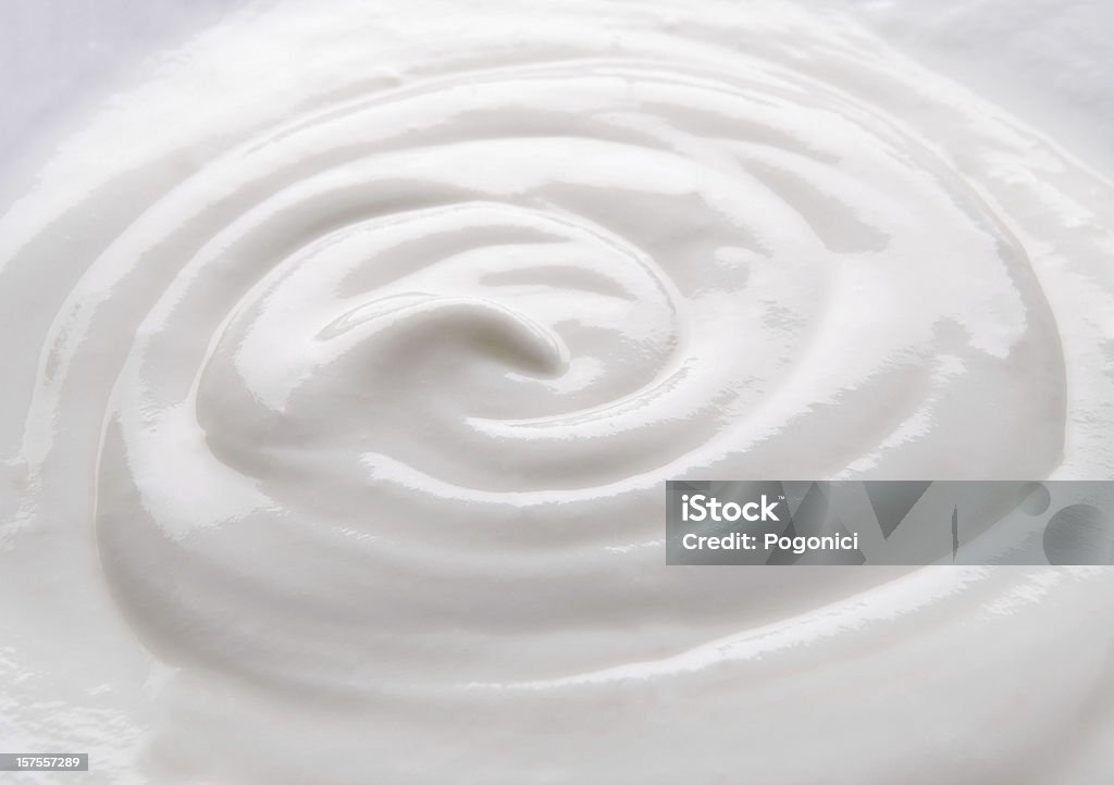 Creamy natural yogurt Creamy natural yogurt background. Closeup view. Wave Pattern Stock Photo
