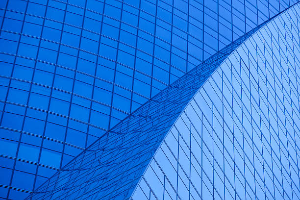 An abstract angle of a Madrid office building exterior, with Tungsten blue lighting.. Check out my:
