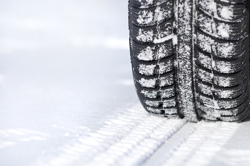 winter tire on snow-covered road