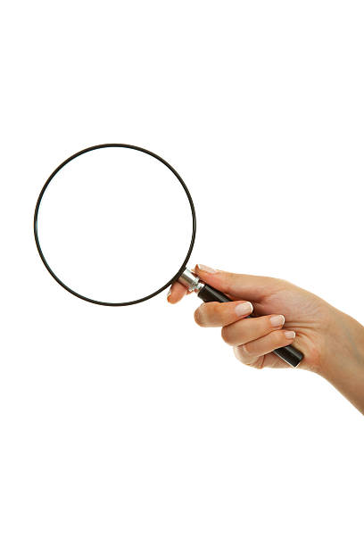 Holding Magnifying Lens Stock Photo - Download Image Now