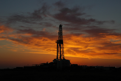 Silhouette of a land drilling rig.