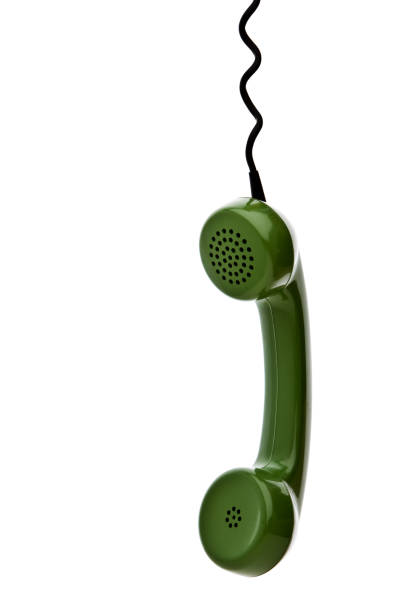Retro Green Phone Receiver Hanging, Studio Isolated stock photo