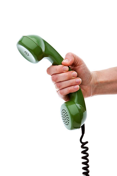 istock Hand Holding Green Phone Receiver, Isolated 157558755