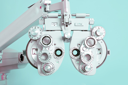 Close up of a phoroptor, an instrument used by eye care professionals during an eye examination.