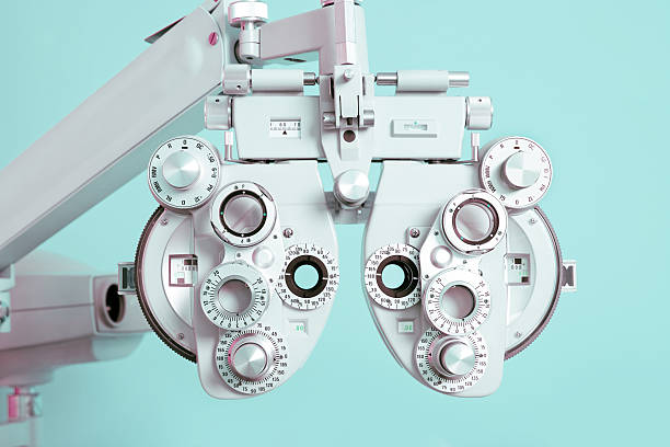 Phoroptor Close Up Close up of a phoroptor, an instrument used by eye care professionals during an eye examination. eye exam stock pictures, royalty-free photos & images