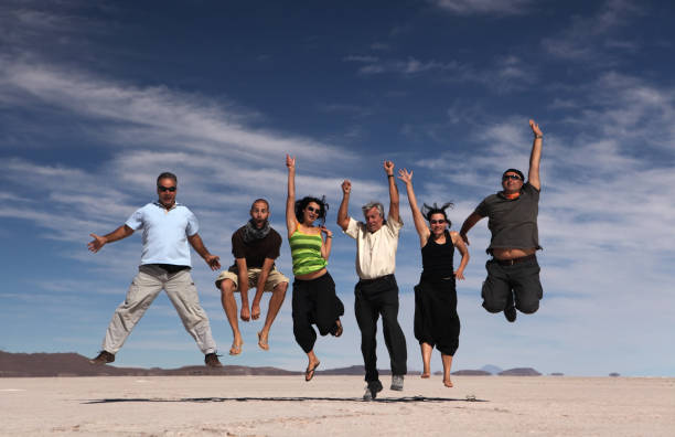 istock Jumping happy people 157558971