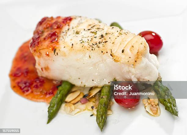Seabass Fillet Of In Sweet And Sour Sauce With Asparagus Stock Photo - Download Image Now