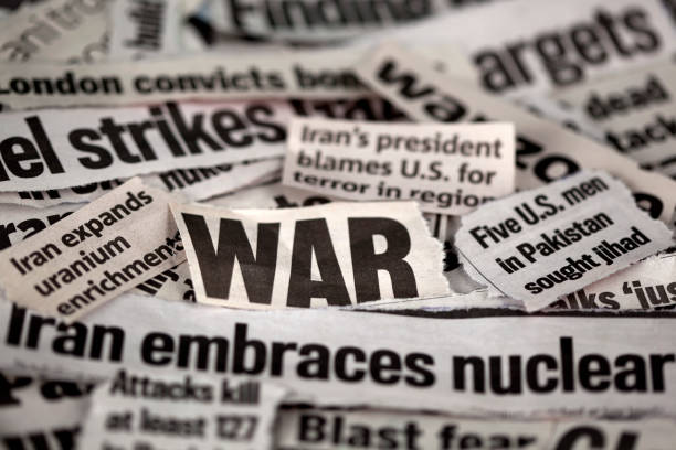 istock Newspaper cut outs with WAR related themes 157559322