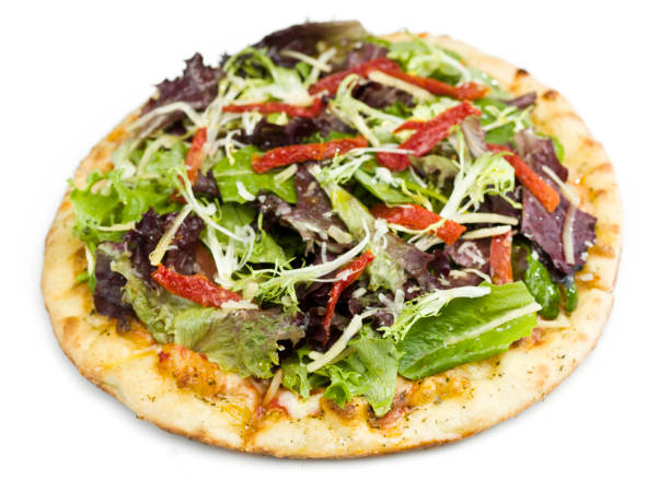 Pizza with tomatoes, mozzarella cheese and arugula. Pizza menu.Top view with copy space on dark stone table