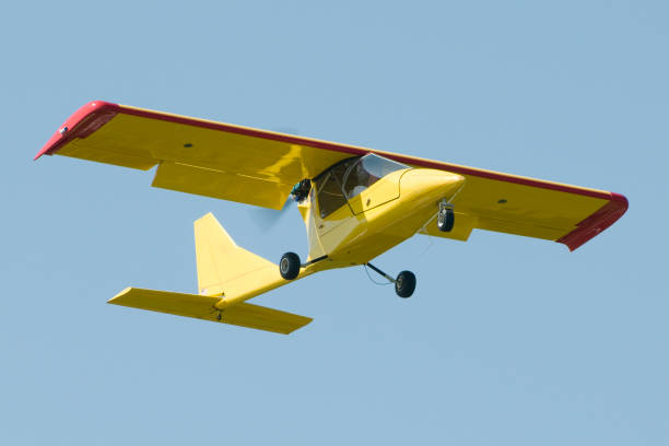 istock light sport aircraft Titan Tornado II flying in blue sky 157560036