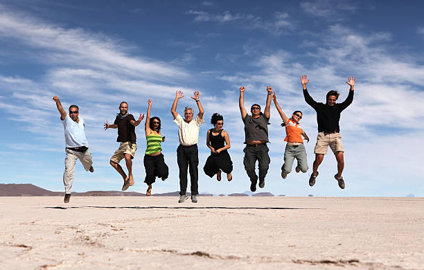 istock Jumping happy people 157560540
